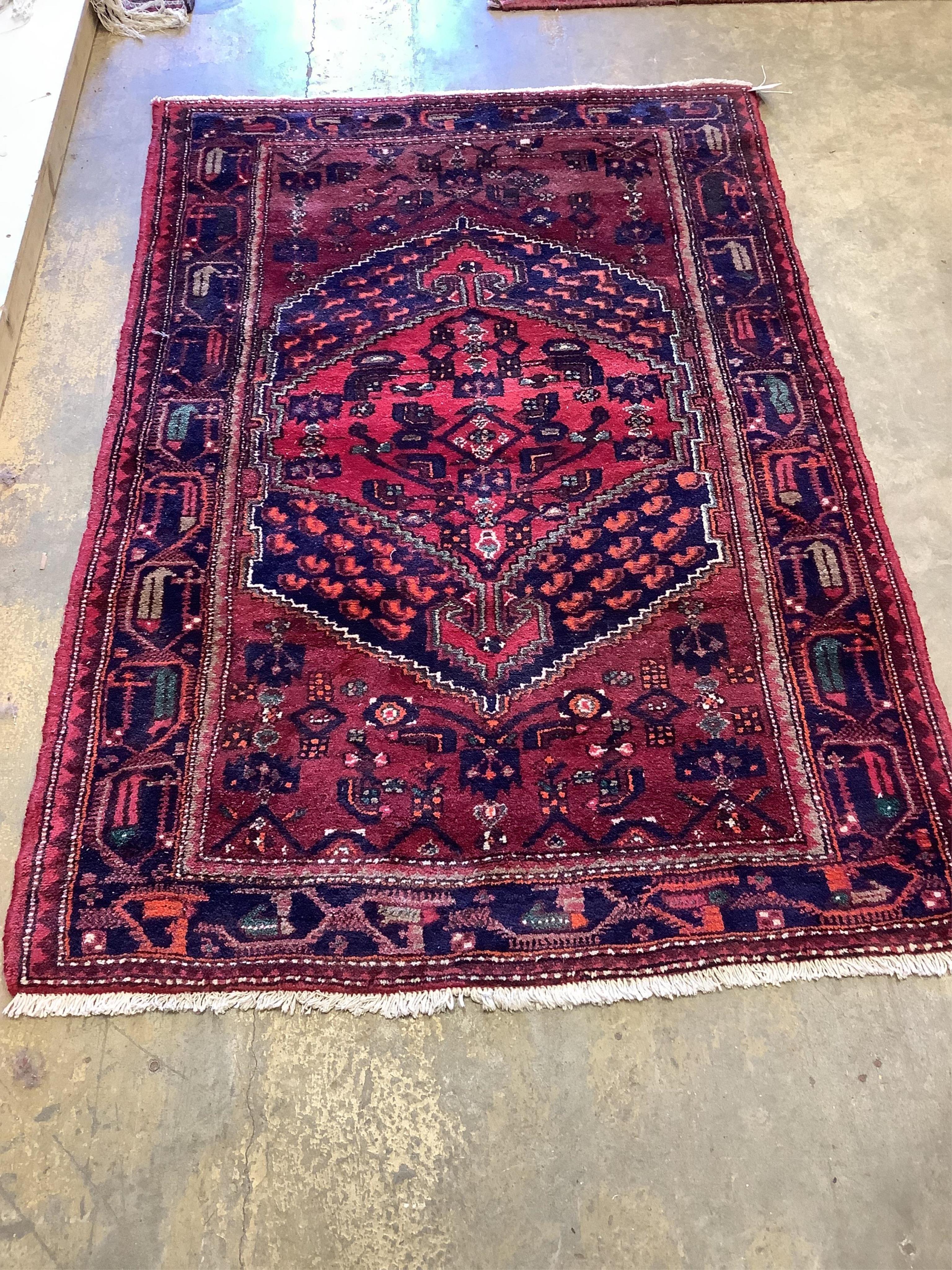 Three assorted Persian rugs, largest 190 x 128cm. Condition - fair